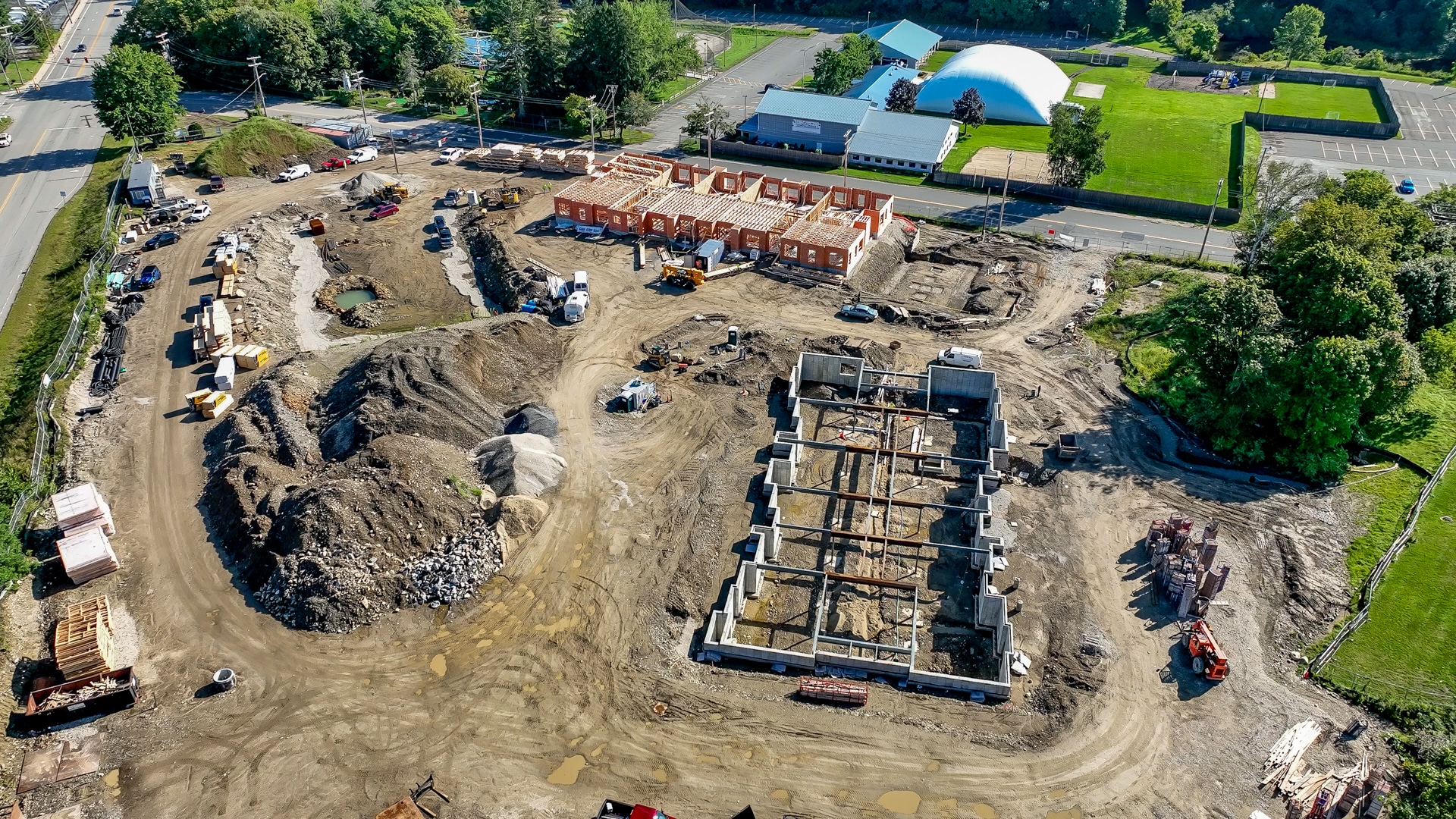An aerial view of the james construction site, with two different foundations laid