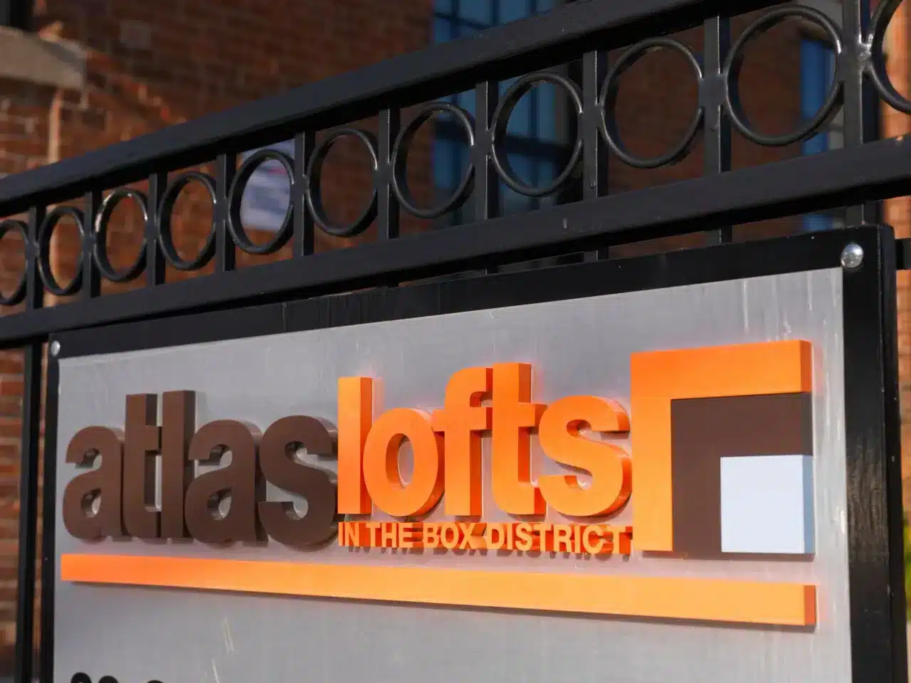 Close up of the atlas lofts logo, but at an angle